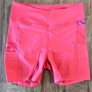 outdoor voices, size large, biker shorts with pockets, orange/pink color